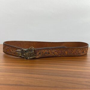 Vintage brown leather hand tooled Western belt.